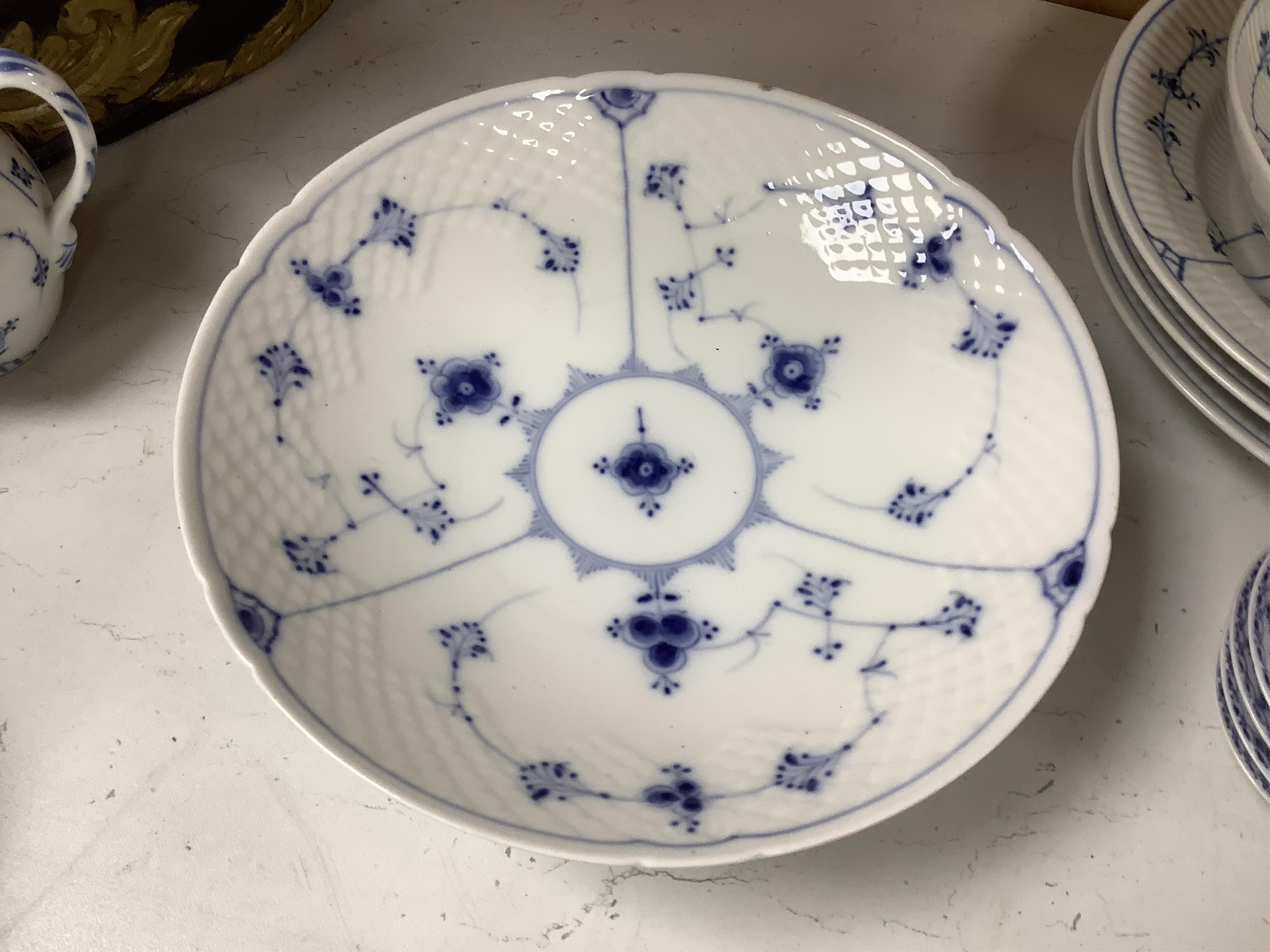 A collection of Royal Copenhagen and Bing & Grondahl onion pattern blue and white tableware